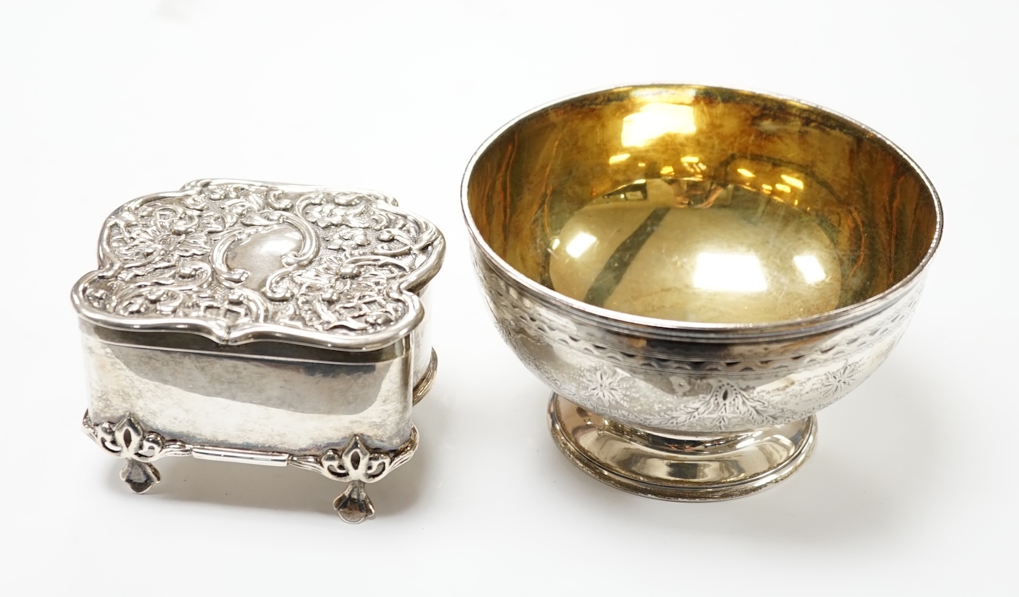 A Victorian silver sugar bowl, Robert Harper, London, 1870, diameter 11.1cm, together with a George V repousse silver trinket box, 8.2oz. Good to fair condition.